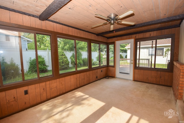3209 E Kendall Ln, Muncie, IN 47303 - unfurnished sunroom featuring wooden ceiling, plenty of natural light, wooden walls, and carpet floors