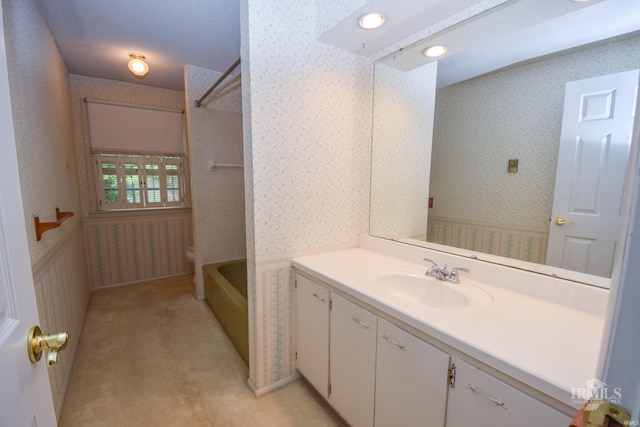 3209 E Kendall Ln, Muncie, IN 47303 - full bath with wallpapered walls, vanity, and  shower combination