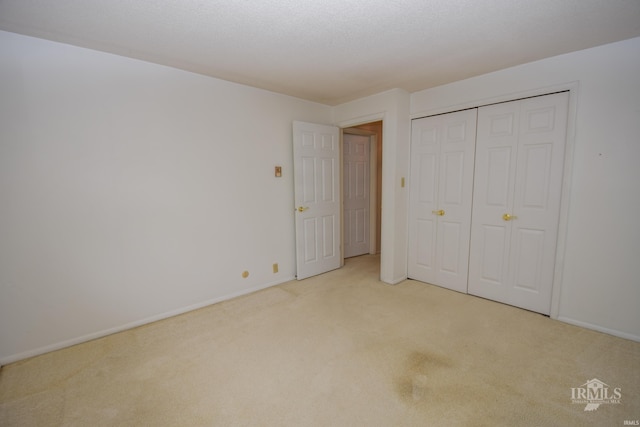 3209 E Kendall Ln, Muncie, IN 47303 - unfurnished bedroom featuring carpet flooring and a closet
