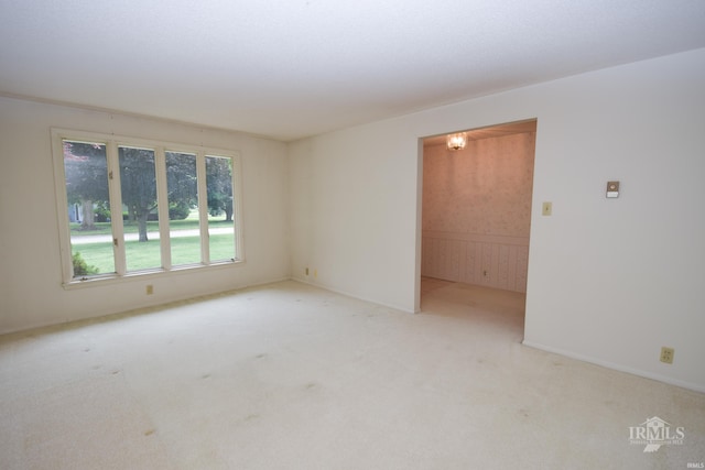 3209 E Kendall Ln, Muncie, IN 47303 - carpeted empty room with wainscoting