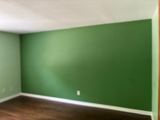 2500 Topsfield Rd Unit 907, South Bend, IN 46614 - unfurnished room with dark wood-style flooring and baseboards