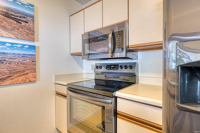 5813 Polo Run, Evansville, IN 47715 - kitchen featuring appliances with stainless steel finishes, light countertops, and tile patterned floors