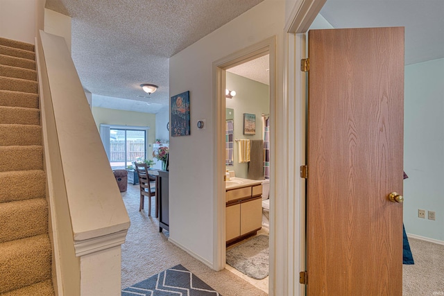5813 Polo Run, Evansville, IN 47715 - corridor featuring light carpet, stairs, and a textured ceiling