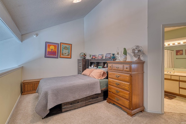 5813 Polo Run, Evansville, IN 47715 - bedroom featuring light colored carpet, vaulted ceiling, ensuite bath, and a textured ceiling