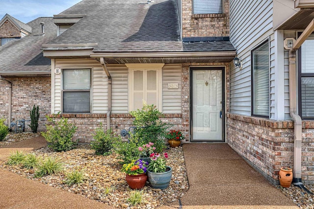 5813 Polo Run, Evansville, IN 47715 - property entrance with roof with shingles and brick siding
