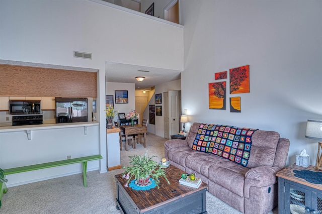 5813 Polo Run, Evansville, IN 47715 - carpeted living room with a towering ceiling and baseboards