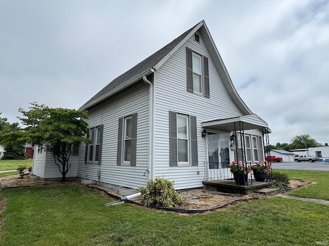 306 W Rochester St, Akron, IN 46910 - view of home's exterior with a lawn