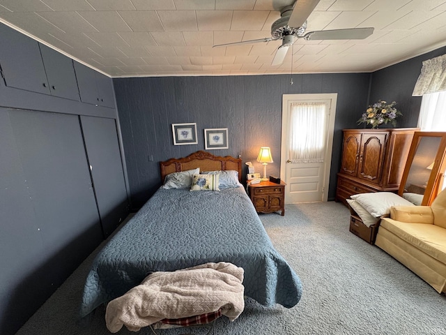 306 W Rochester St, Akron, IN 46910 - bedroom with carpet, ceiling fan, and wood walls