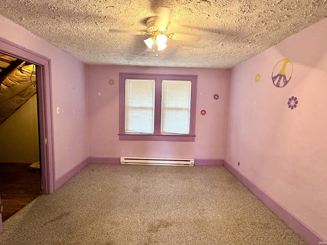203 E Church St, Milroy, IN 46156 - carpeted spare room featuring baseboard heating, a ceiling fan, and a textured ceiling