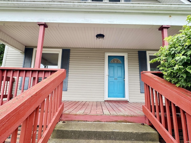 203 E Church St, Milroy, IN 46156 - property entrance with a porch