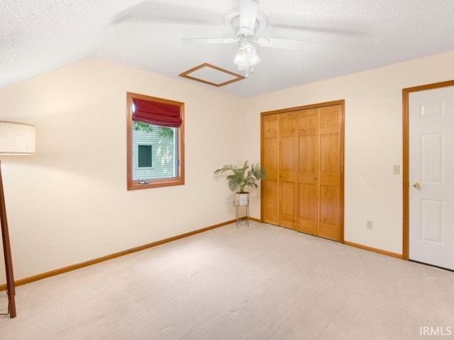 2133 Blue Harbor Dr, Fort Wayne, IN 46804 - unfurnished bedroom featuring a closet, a textured ceiling, lofted ceiling, carpet, and ceiling fan