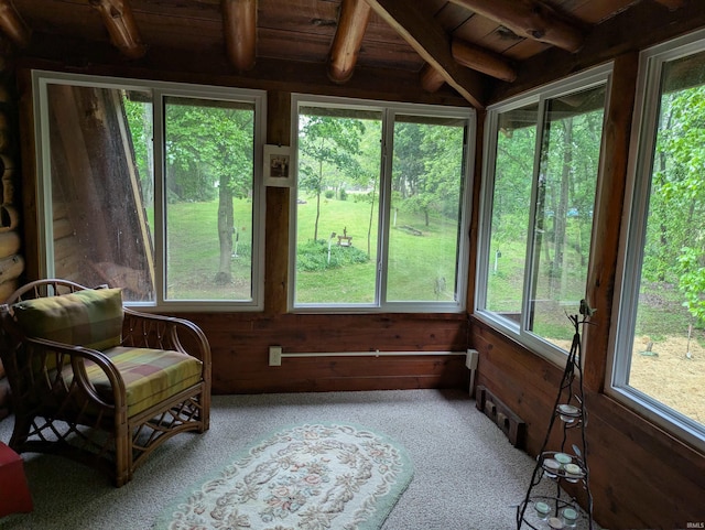 5775 N 175 W, Howe, IN 46746 - sunroom with plenty of natural light, a wood ceiling with exposed beams, carpet flooring, and wooden walls