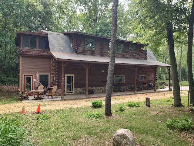 5775 N 175 W, Howe, IN 46746 - back of property featuring log siding, a patio area, and a lawn