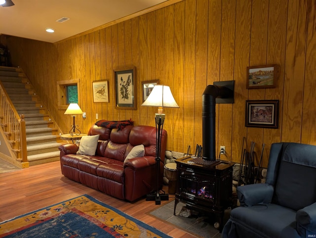 5775 N 175 W, Howe, IN 46746 - living area with a wood stove, wood walls, wood finished floors, and stairs
