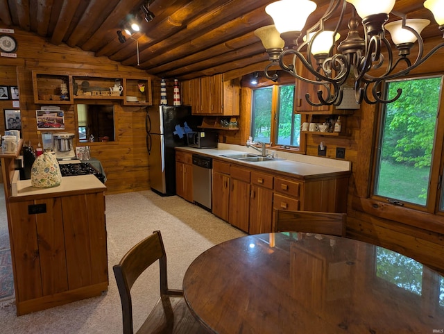 5775 N 175 W, Howe, IN 46746 - kitchen with appliances with stainless steel finishes, a chandelier, wood walls, brown cabinets, and light countertops