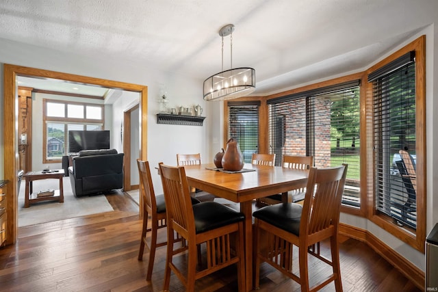 4416 Lakeshore Dr, Kokomo, IN 46902 - dining space featuring hardwood / wood-style floors, a chandelier, and a textured ceiling