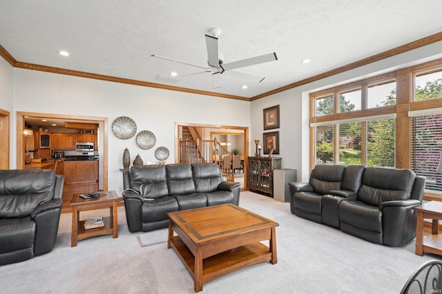 4416 Lakeshore Dr, Kokomo, IN 46902 - living area with light carpet, ceiling fan, crown molding, stairs, and recessed lighting