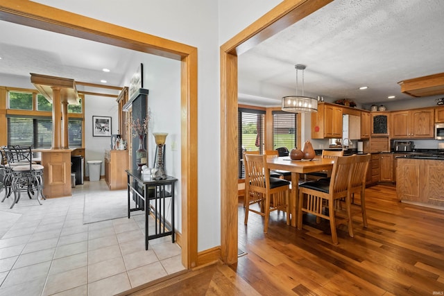 4416 Lakeshore Dr, Kokomo, IN 46902 - dining space with light wood-type flooring, recessed lighting, and a textured ceiling