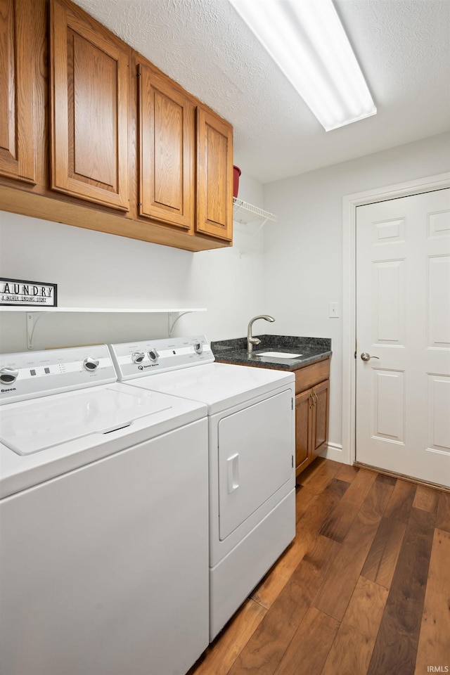 4416 Lakeshore Dr, Kokomo, IN 46902 - laundry room featuring washer and dryer, dark wood-style flooring, and cabinet space