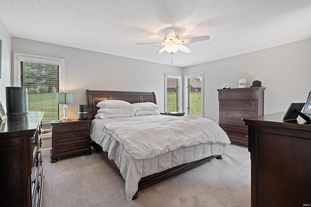 4416 Lakeshore Dr, Kokomo, IN 46902 - bedroom featuring light carpet, an office area, a ceiling fan, and a textured ceiling