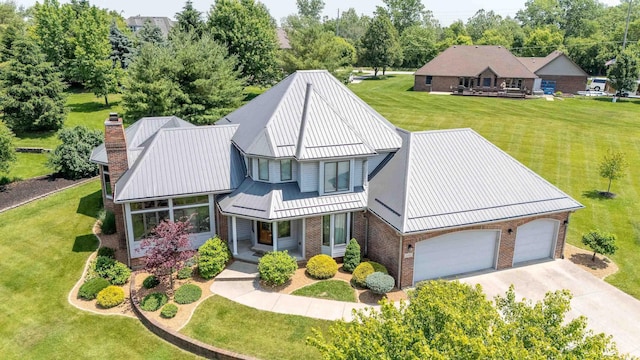 4416 Lakeshore Dr, Kokomo, IN 46902 - view of front facade with brick siding, covered porch, driveway, and a front yard
