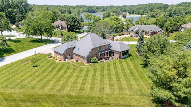 4416 Lakeshore Dr, Kokomo, IN 46902 - aerial view of property and surrounding area featuring a large body of water and a heavily wooded area