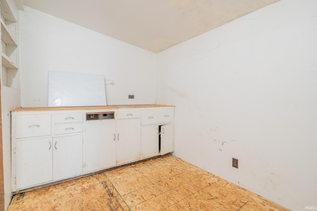 921 Race St, Logansport, IN 46947 - kitchen featuring white cabinets, light countertops, and open shelves