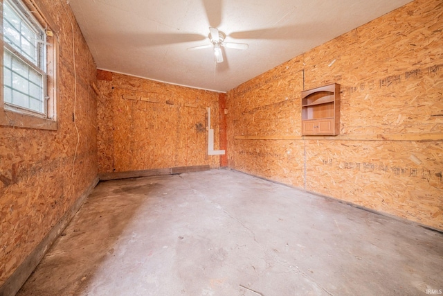 921 Race St, Logansport, IN 46947 - spare room featuring unfinished concrete floors and a ceiling fan