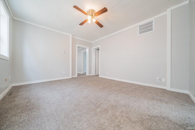 921 Race St, Logansport, IN 46947 - spare room with ceiling fan, ornamental molding, carpet floors, and a textured ceiling