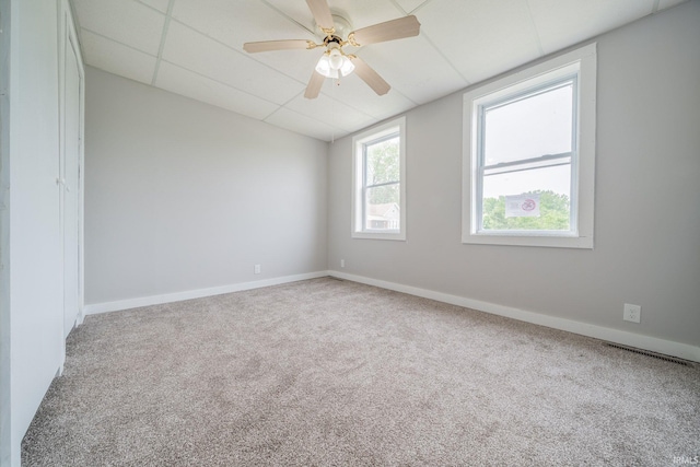 921 Race St, Logansport, IN 46947 - carpeted empty room with ceiling fan and a paneled ceiling