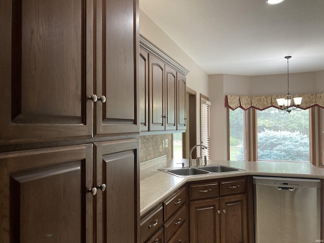 1526 Treyburn Ct, Bluffton, IN 46714 - kitchen featuring stainless steel dishwasher, a chandelier, a peninsula, light countertops, and pendant lighting