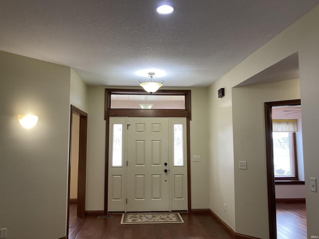 1526 Treyburn Ct, Bluffton, IN 46714 - foyer entrance with dark wood-type flooring, a textured ceiling, and recessed lighting