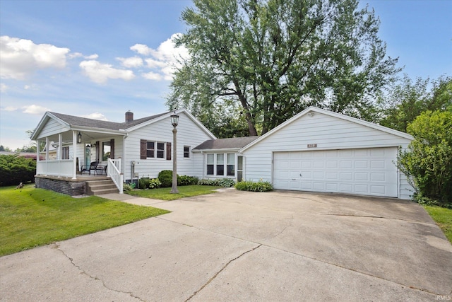439E 17th St, Mishawaka, IN 46544 - view of front facade with covered porch, a front yard, driveway, an attached garage, and a chimney