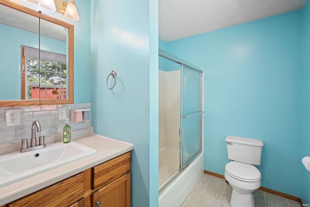 3076 N 450 Rd E, Logansport, IN 46947 - bathroom featuring vanity, decorative backsplash, combined bath / shower with glass door, and tile patterned floors