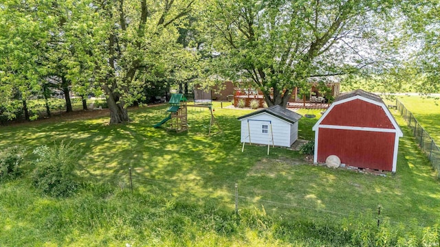 3076 N 450 Rd E, Logansport, IN 46947 - view of yard with a storage unit, a playground, and view of scattered trees