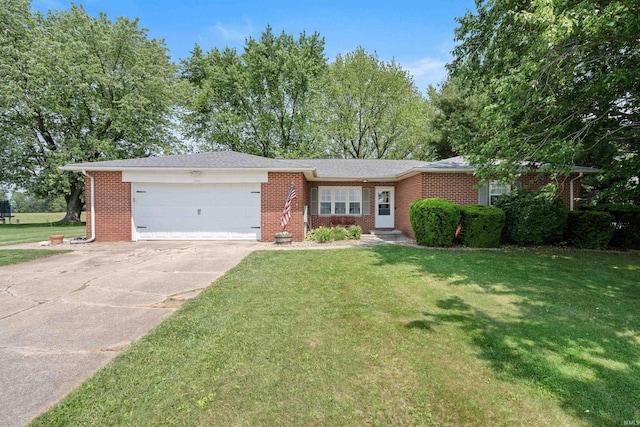 3076 N 450 Rd E, Logansport, IN 46947 - ranch-style home featuring a garage, concrete driveway, a front lawn, and brick siding