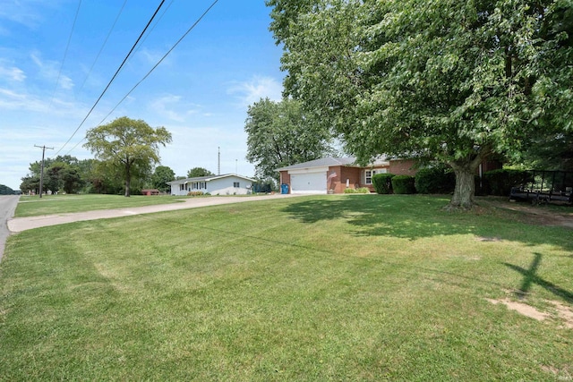 3076 N 450 Rd E, Logansport, IN 46947 - view of green lawn with an attached garage