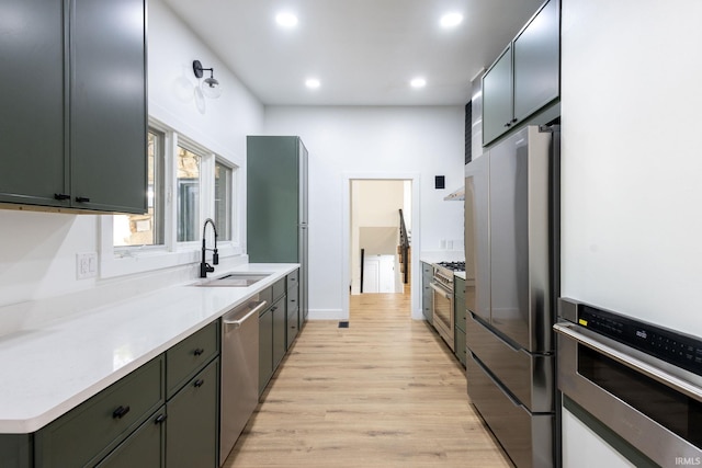 5228 N Lee Ct, South Bend, IN 46614 - kitchen featuring appliances with stainless steel finishes, light wood-style flooring, recessed lighting, and light countertops
