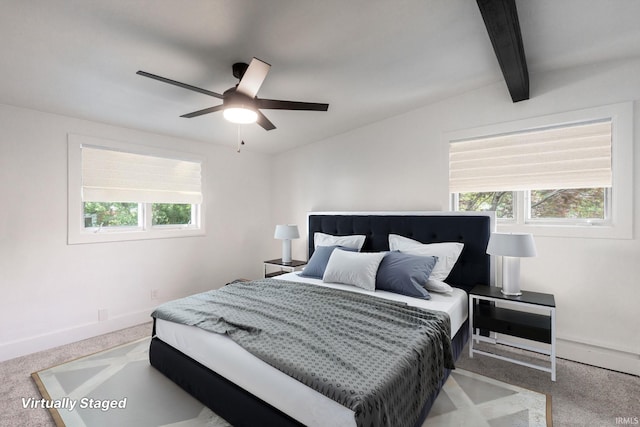 5228 N Lee Ct, South Bend, IN 46614 - carpeted bedroom featuring multiple windows, beam ceiling, and ceiling fan
