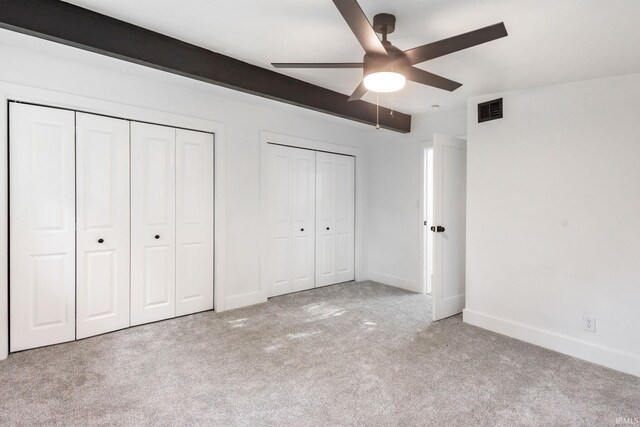 5228 N Lee Ct, South Bend, IN 46614 - unfurnished bedroom featuring carpet floors, two closets, and ceiling fan