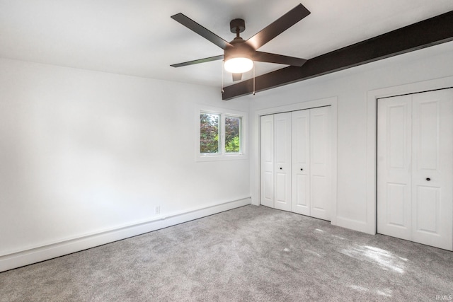 5228 N Lee Ct, South Bend, IN 46614 - unfurnished bedroom featuring a baseboard radiator, carpet floors, two closets, beam ceiling, and ceiling fan