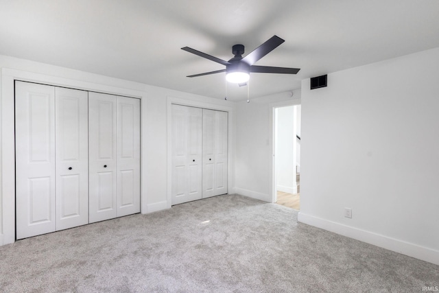 5228 N Lee Ct, South Bend, IN 46614 - unfurnished bedroom with two closets, carpet, and ceiling fan