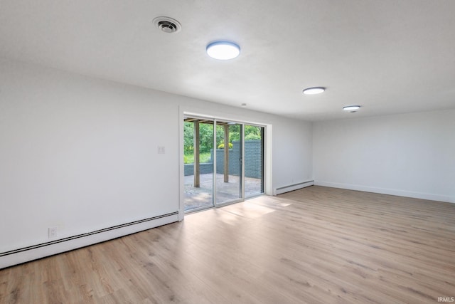 5228 N Lee Ct, South Bend, IN 46614 - empty room with baseboard heating and light wood-style flooring
