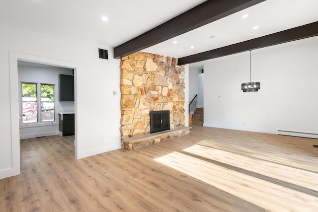 5228 N Lee Ct, South Bend, IN 46614 - unfurnished living room with a baseboard heating unit, wood finished floors, beam ceiling, recessed lighting, and a fireplace