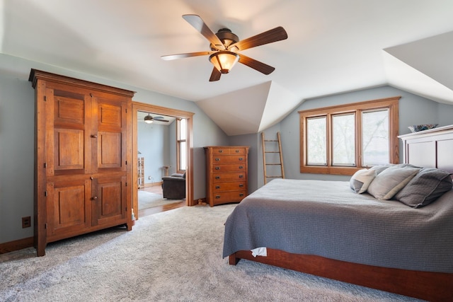 1791 Chapman Lake Dr, Warsaw, IN 46582 - bedroom with light colored carpet, vaulted ceiling, and a ceiling fan