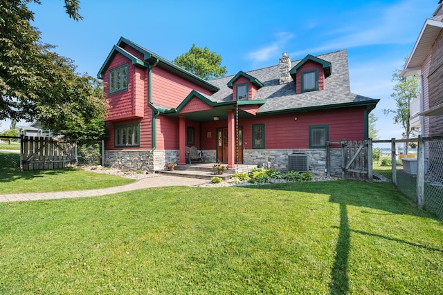 1791 Chapman Lake Dr, Warsaw, IN 46582 - view of front of home with stone siding, a gate, covered porch, and a chimney