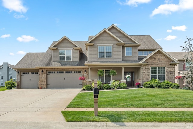 1869 Paloma Ct, Lafayette, IN 47909 - craftsman inspired home with driveway, a front lawn, brick siding, a garage, and a porch