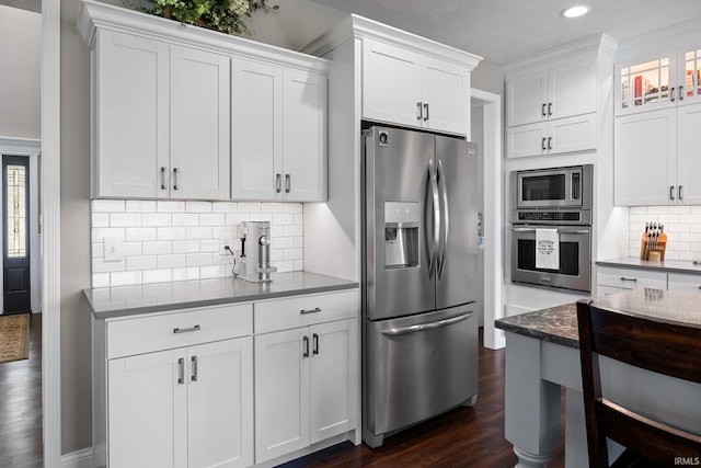 1869 Paloma Ct, Lafayette, IN 47909 - kitchen featuring appliances with stainless steel finishes, white cabinets, decorative backsplash, recessed lighting, and dark wood-style flooring