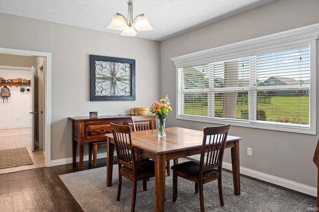 1869 Paloma Ct, Lafayette, IN 47909 - dining space with dark wood-type flooring and a chandelier