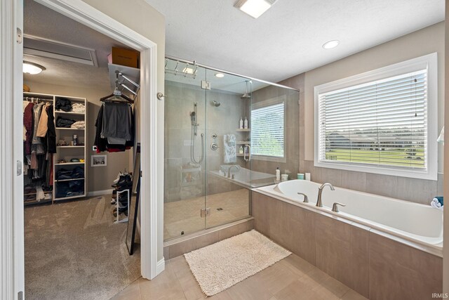 1869 Paloma Ct, Lafayette, IN 47909 - bathroom featuring a bath, a shower stall, and a spacious closet